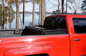 Lund 07-13 Toyota Tundra Fleetside (8ft. Bed) Hard Fold Tonneau Cover - Black