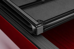 Lund 05-17 Nissan Frontier Styleside (6ft. Bed) Hard Fold Tonneau Cover - Black